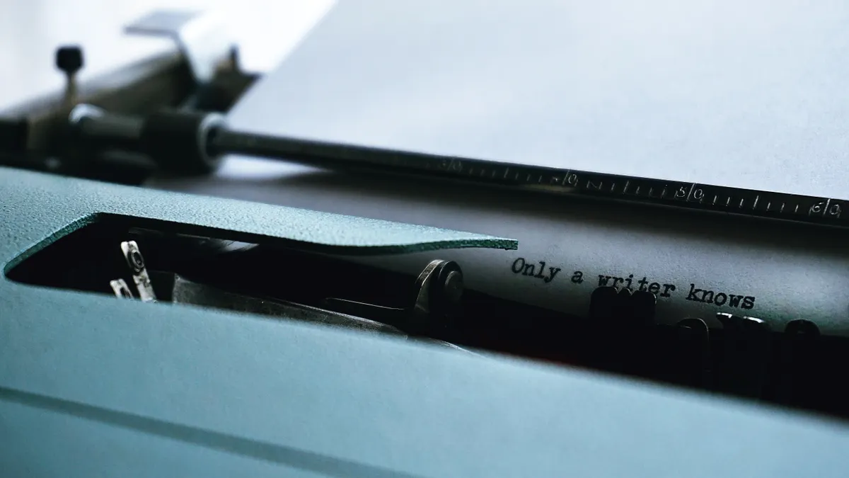 AI content writing tools vs human content writers — Close-up Photography of Typewriter With Only a Writer Knows Text on 