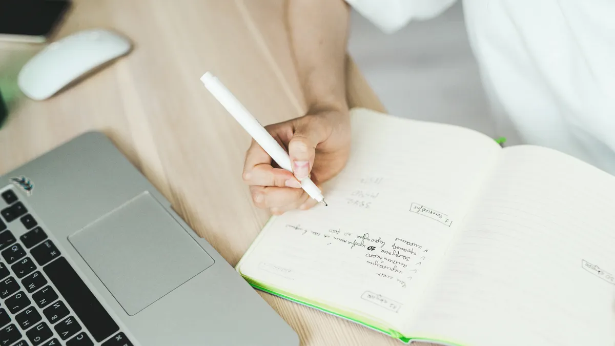 Best content writers for blogs and SEO content — A Person Writing on a Notebook