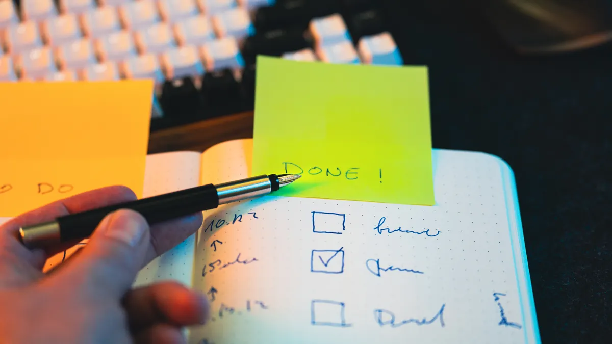 Content Writing Services and Tools — The Complete Guide — Hand Writing in Notebook with Checklist and Sticky Note