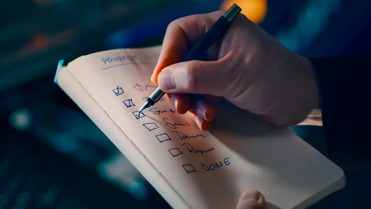 Content Writing Services and Tools — The Complete Guide — Hand Writing on Notebook with Checklist