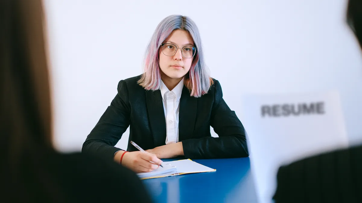 job interview with a resume visible on the table