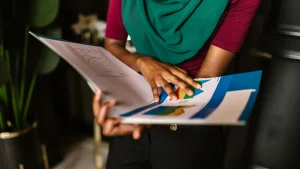 Person reviewing a portfolio folder